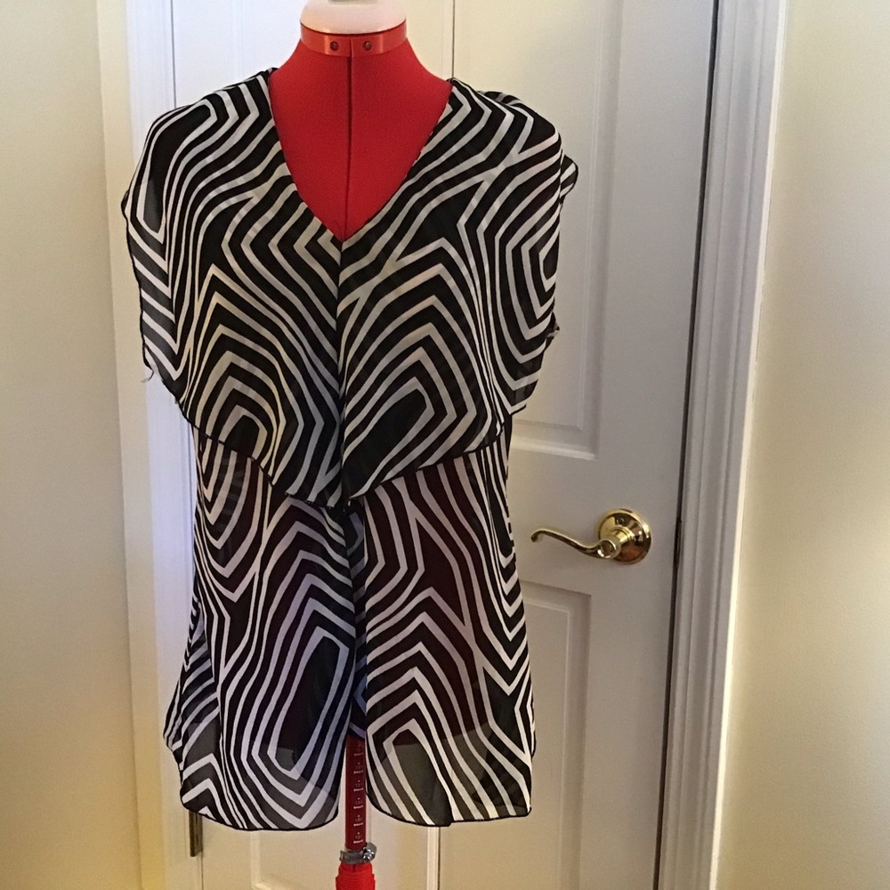 Women’s Sunny Leigh black and white dressy sleeveless top.